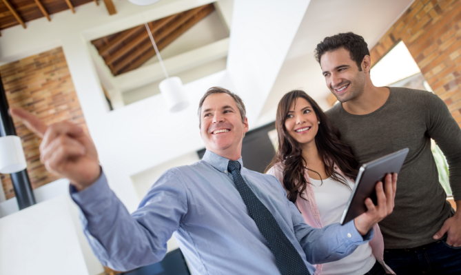 A real estate agent showing property to client.